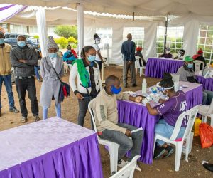 Staff of Thika Cloth Mills Ltd in Kiambu County  queue to benefit from an array of health services during a 'Mini Medical Safari' conducted by Beyond Zero Initiative in conjuction with various health services providers.